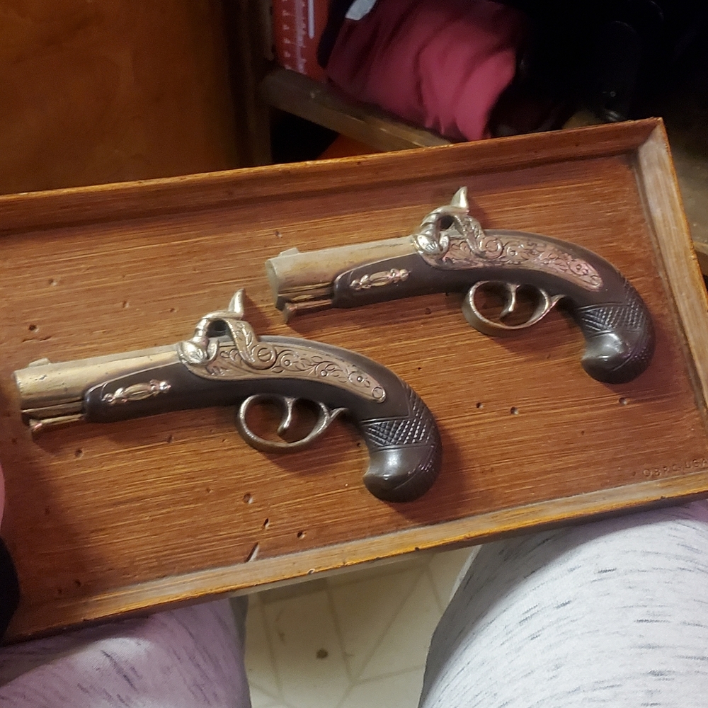 Vintage metal and wood gun wall hanging